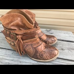 Leather booties with fabulous burned details!